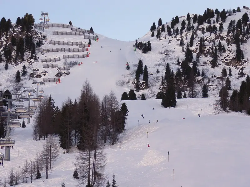 The snowy Harakiri piste with safety netting, ski tracks on the Mayrhofen slope