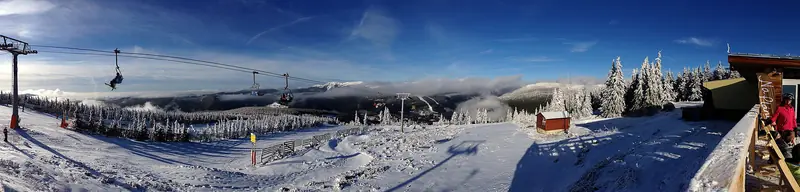 A panorama of the snowy Svatý Petr pistes and chairlift above Špindlerův Mlýn